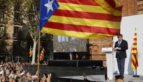 epa11535503 Former Catalan president Carles Puigdemont (R) addresses supporters in Barcelona, Spain, 08 August 2024. Catalonia's former president Carles Puigdemont returned to Spain after seven years of self-imposed exile abroad, despite a pending arrest warrant. The Mossos d'Esquadra was deployed early morning on 08 August to secure access to the Parliament for the investiture of Salvador Illa. The plenary session of the Parliament will host the investiture debate of the Socialist leader Salvador Illa as the new president of the Generalitat, the government of Catalonia. EPA/ALBERTO ESTEVEZ