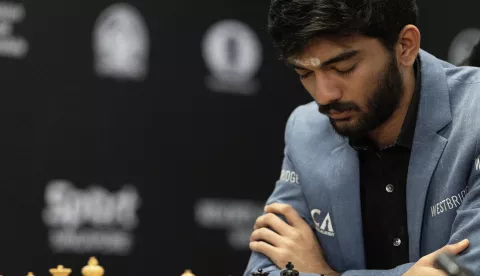 epa11771903 Chess grandmaster Gukesh Dommaraju of India competes in Game 14 against Ding Liren (not pictured) of China at the FIDE World Chess Championship in Singapore, 12 December 2024. EPA/HOW HWEE YOUNG