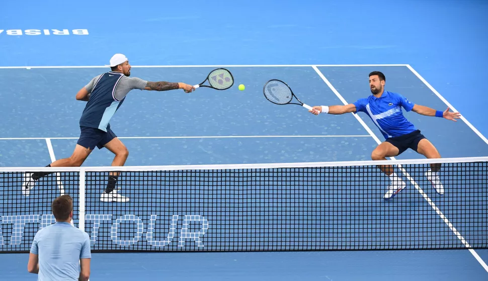 epaselect epa11800784 Novak Djokovic (R) of Serbia and Nick Kyrgios (L) of Australia in action during their doubles match against Nikola Mektic and Michael Venus of New Zealand at the Brisbane International tennis tournament in Queensland Tennis Centre in Brisbane, Australia, 01 January 2025. EPA/JONO SEARLE AUSTRALIA AND NEW ZEALAND OUT