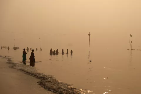 epa11821418 Hindu devotees take a holy dip in the Bay of Bengal during the second day of Ganga Sagar fair on Sagar Island, India, 13 January 2025. The fair is an annual gathering of Hindu pilgrims during Makar Sankranti to take a dip in the sacred waters of the Ganga River before it merges into the Bay of Bengal. EPA/PIYAL ADHIKARY