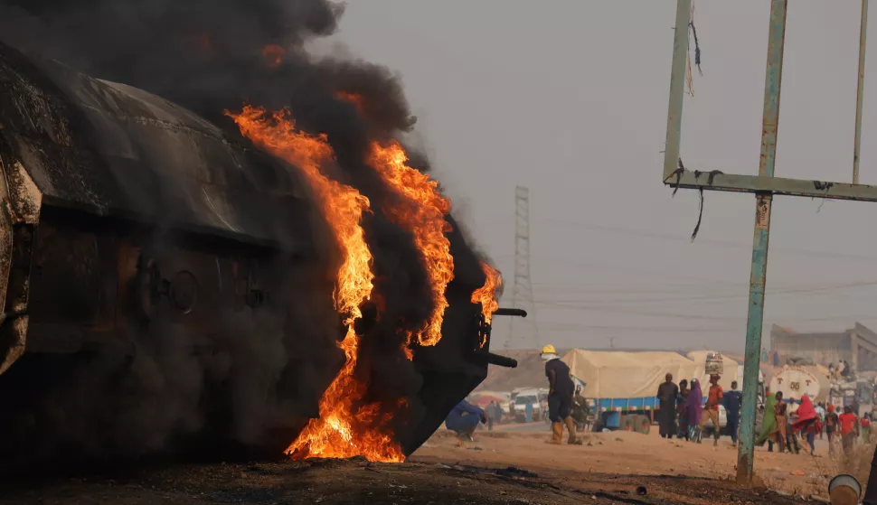 epa11834749 The wreckage of a fuel tanker burns at the Dikko junction, a road linking Abuja to Kaduna, Nigeria, 18 January 2025. According to the National Emergency Agency, over 78 burned bodies were recovered at the scene after the fuel tanker overturned and spilled the cargo, killing people who had gathered to take the spilled fuel. EPA/AFOLABI SOTUNDE