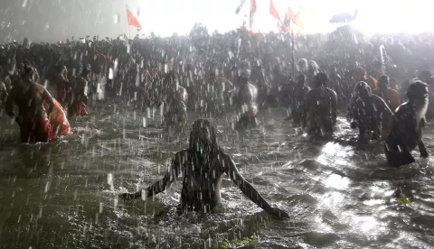 epa11823363 Hindu naked ascetic holy men, known as Naga Sadhus, take part in a sacred bathing ritual, or 'Shahi Snan', during the Kumbh Mela festival at Sangam, the confluence of the holy rivers Ganges, Yamuna and Saraswati, in Prayagraj, northern state of Uttar Pradesh, India, 14 January 2025. Hundreds of millions of pilgrims from across India are expected to gather for ritual baths at the confluence of India's sacred Ganges river, Yamuna river and the mythical Saraswati during the six-week Hindu festival held every 12 years. EPA/RAJAT GUPTA
