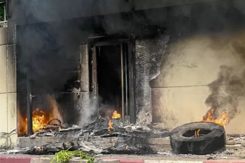 epa11859327 A fire set by protesters burns outside the damaged French Embassy during a march in Kinshasa, Democratic Republic of Congo, 28 January 2025. Protesters took to the streets and reportedly attacked the embassies of Rwanda, France, Belgium and the United States, as they criticize international inaction as fighting between the Congolese military and the M23 rebels, supported by Rwanda, has left many casualties in Goma in the east of the country. EPA/CHRIS MILOSI