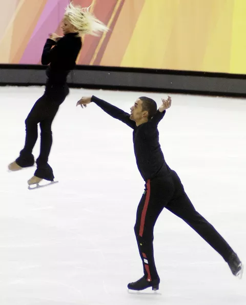 epa00633882 Aliona Savchenko (L) and Robin Szolkowy of Germany are seen practicing for the Pairs Figure Skating competition in the Turin 2006 Winter Olympic Games in the Palavela venue Wednesday 8 February 2006.