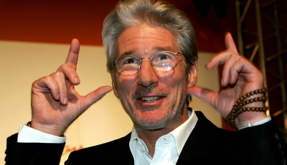epa00840743 US actor Richard Gere, gestures as he attends the presentation of his new film 'The Hoax', during the first International Film Festival in Rome, Italy on Sunday 15 October 2006. EPA/CLAUDIO ONORATI