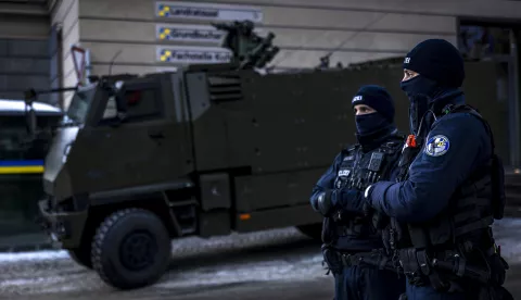 epa11830157 Members of the police and army stand guard outside the district council chamber during a press conference of police and army regarding security prior the annual meeting of the World Economic Forum (WEF), in Davos, Switzerland, 17 January 2025. The WEF brings together entrepreneurs, scientists, corporate and political leaders in Davos and takes place in Davos from 20 to 24 January. EPA/MICHAEL BUHOLZER
