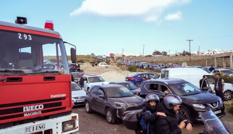 epa11873205 Residents and visitors of Santorini are forming queues with their cars towards the port of Athinios, as they leave the island due to the increased seismic activity of the last few days, Santorini island, Greece, 03 February 2025. More than 400 tremors occurred in the last few days in the sea area between Santorini and Amorgos while at least 12 of these exceeded 4 on the Richter scale. Scientists emphasize that the seismic activity may last for weeks. EPA/CHRISTOS YANTSIS