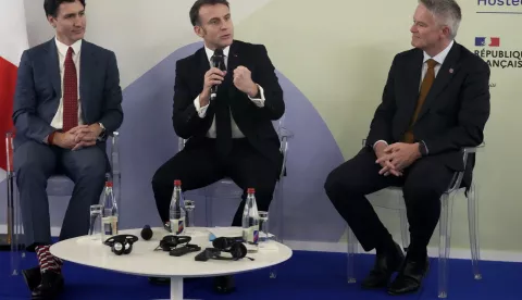 epa11884837 French President Emmanuel Macron (C) meets with Canadian Prime Minister Justin Trudeau (L) and Secretary General of the OECD Mathias Cormann (R) at the Elysee Palace in Paris, France, 09 February 2025, ahead of the Artificial Intelligence (AI) Action Summit. The summit takes place from 10 to 11 February. EPA/MICHEL EULER/POOL
