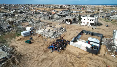 epa11880469 Palestinians perform Friday prayers in front of their homes destroyed by Israeli shelling, in Khan Yunis, southern Gaza Strip, 07 February 2025, amid a ceasefire between Israel and Hamas. More than 46,000 Palestinians have been killed in the Gaza Strip, according to the Palestinian Ministry of Health, since Israel launched a military campaign in the strip in response to a cross-border attack led by the Palestinian militant group Hamas on 07 October 2023, in which about 1,200 Israelis were killed and more than 250 taken hostage. EPA/HAITHAM IMAD