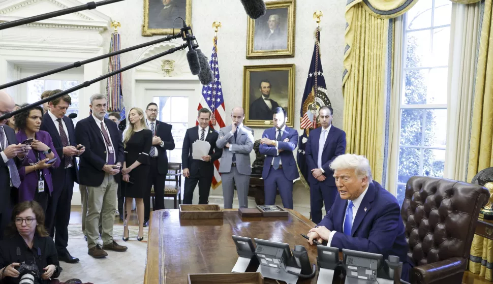 epa11875442 US President Donald Trump talks to reporters as he signs a series of executive orders in the Oval Office of the White House in Washington, DC, USA, 04 February 2025. EPA/SHAWN THEW/POOL