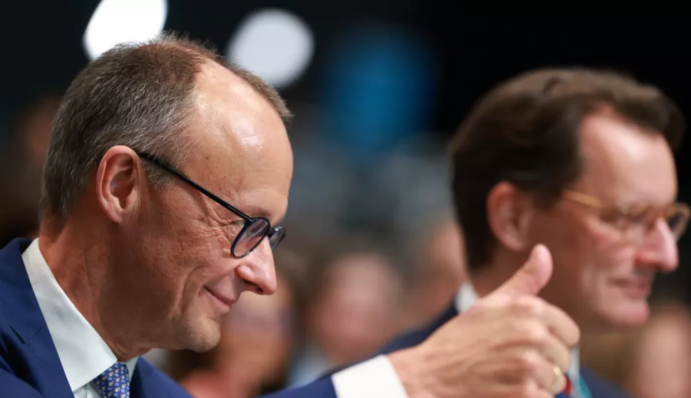 epa11872529 Chairman of the Christian Democratic Union (CDU) party and faction Friedrich Merz (L) gestures next to North Rhine-Westphalia State Premier Hendrik Wuest during the Christian Democratic Union (CDU) federal party conference in Berlin, Germany, 03 February 2025. The 37th CDU party conference takes place 20 days ahead of the German federal elections scheduled for 23 February 2025. EPA/CLEMENS BILAN