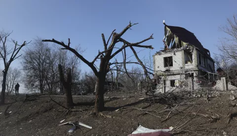 epa11891246 A man walks past a damaged building in Orikhiv, Zaporizhzhia region, Eastern Ukraine, 12 February 2025. The city, located about 10 kilometers from the frontline, is shelled on a daily basis with guided aerial bombs and FPV drone hunts, according to the Southern Defense Forces spokesperson. Less than 1,500 people currently live in Orikhiv, compared to its original population of 15,000 before Russia launched its full-scale invasion of Ukraine in 2022. EPA/OLEG MOVCHANIUK