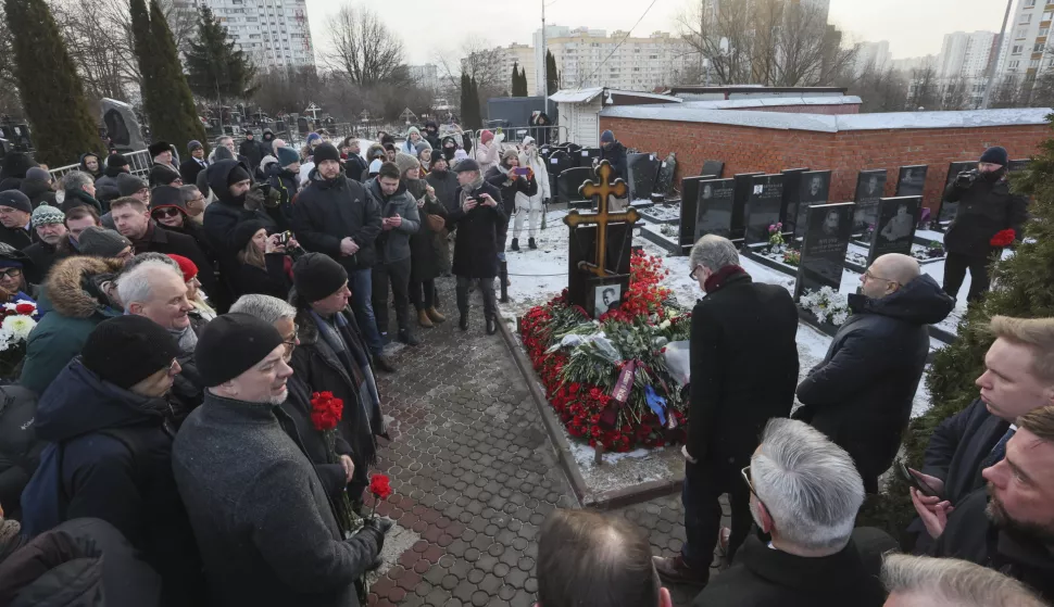 epa11899771 People lay flowers on the grave of late Russian opposition leader Alexei Navalny at the Borisovskoye cemetery, in Moscow, Russia, 16 February 2025. Navalny died aged 47 in an arctic penal colony on 16 February 2024, after being transferred there in 2023. The colony is considered to be one of the world's harshest prisons. Alexei Navalny's body was laid to rest on 01 March 2024 at the Borisovskoye cemetery in Moscow. EPA/MAXIM SHIPENKOV