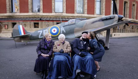 epa11902546 (L-R) Second World War child evacuee Doreen Simson, Women's Royal Naval Service veteran Ruth Barnwell, Second World War veteran Henry Rice, and lead vocalist of The D-Day Darlings band Katie Ashby pose with a full-size replica of a Spitfire fighter aircraft outside the Royal Albert Hall as the SSAFA charity marks the 80-day countdown to the 80th anniversary of Victory in Europe Day (VE Day) in London, Britain, 17 February 2025. Armed Forces charity's VE Day 80: The Party on 08 May 2025 will feature the Royal Philharmonic Concert Orchestra and RAF Squadronaires at the Royal Albert Hall. EPA/TOLGA AKMEN