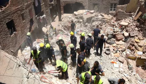 epa10751349 Search and rescue teams inspect the site of the wreckage of a collapsed building at Hadaeq El-Qubbah area of Cairo, Egypt, 17 July 2023. According to initial reports, at least 9 people died due to the building's collapse. Rescue operations are still underway to search for any survivors under the ruins of the building, with inspections being conducted on the neighboring houses. EPA/KHALED ELFIQI
