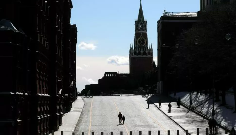 epa09873571 People walk in the Red Square outside the Kremlin in Moscow, Russia, 06 April 2022. On 24 February Russian troops had entered Ukrainian territory in what the Russian president declared a 'special military operation', resulting in fighting, and multiple sanctions against Russia. EPA/MAXIM SHIPENKOV