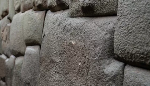 epa11906149 View of the damage to the 'stone of the 12 angles' in Cuzco, Peru, 18 February 2025. The famous 'stone of the 12 angles', which is part of a great wall built 500 years ago by the Incas, was damaged during the early hours of 18 February in the city of Cuzco by an unidentified person, who hit it in seven different points, official sources reported. EPA/Nath Flores