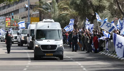 epa11909562 A convoy carrying the bodies of four Israeli hostages handed over by Hamas arrives at the National Center of Forensic Medicine in Tel Aviv, Israel, 20 February 2025. Hamas handed over the bodies of four Israeli captives, including that of youngest hostage Kfir Bibas, as part of the ongoing Gaza ceasefire deal. Hamas said in November 2023 that the two Bibas boys and their mother had been killed in an Israeli airstrike on Gaza. EPA/ABIR SULTAN