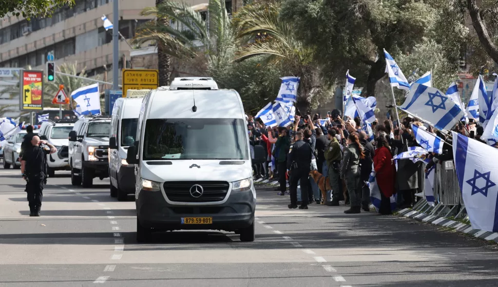 epa11909562 A convoy carrying the bodies of four Israeli hostages handed over by Hamas arrives at the National Center of Forensic Medicine in Tel Aviv, Israel, 20 February 2025. Hamas handed over the bodies of four Israeli captives, including that of youngest hostage Kfir Bibas, as part of the ongoing Gaza ceasefire deal. Hamas said in November 2023 that the two Bibas boys and their mother had been killed in an Israeli airstrike on Gaza. EPA/ABIR SULTAN
