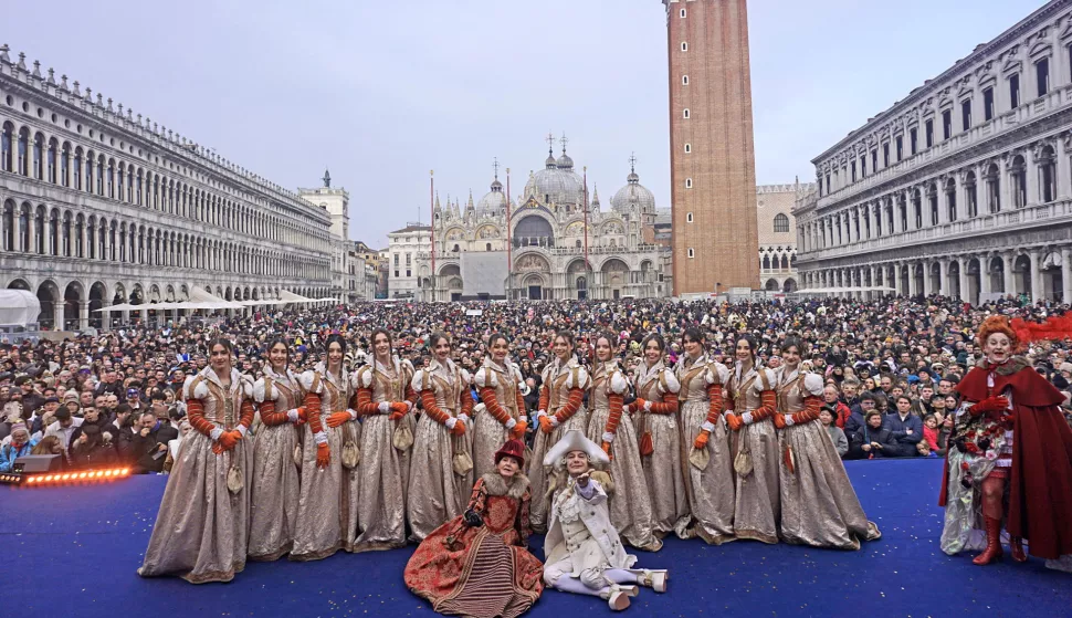 epa11916227 The young Maries of the Venice Carnival gather on stage to be presented to the public in San Marco square, Venice, Italy, 22 February 2025. The Feast of the Marys (Festa della Marie) marks the opening of the Venice Carnival running from 22 February to 04 March 2025. EPA/ANDREA MEROLA