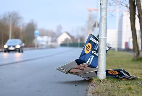 epaselect epa11917645 A damaged election campaign poster of Christian Democratic Union (CDU) leader Friedrich Merz in Arnsberg, Germany, 23 February 2025. About 60 million people are eligible to vote in the German elections for a new federal parliament, the 21st Bundestag. EPA/FABIAN STRAUCH