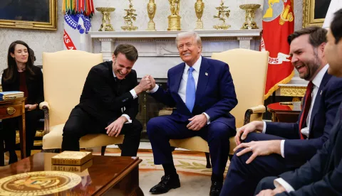 epa11922012 US President Donald Trump (C) and French President Emmanuel Macron (2-L) shake hands during their meeting in the Oval Office of the White House in Washington, DC, USA, 24 February 2025. EPA/LUDOVIC MARIN/POOL