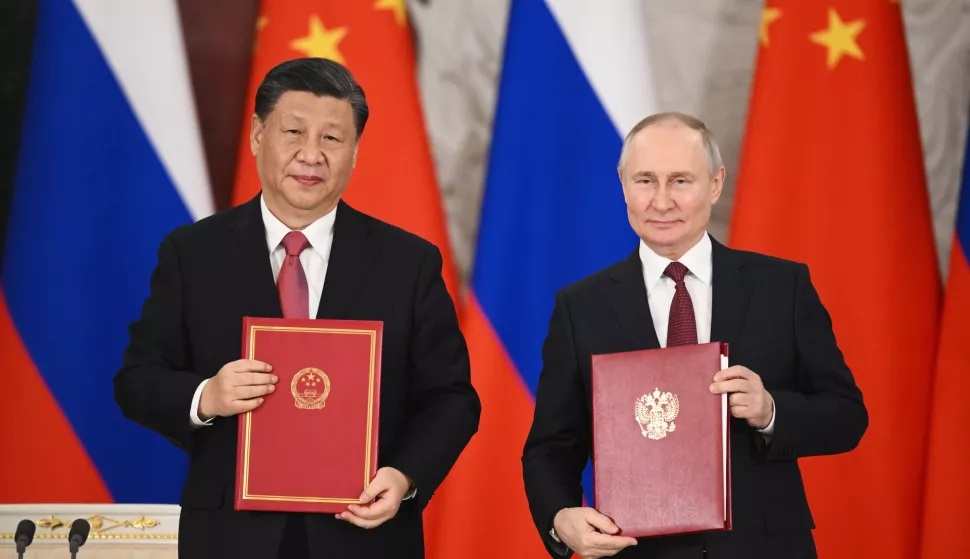 epa10535307 Chinese President Xi Jinping (L) and Russian President Vladimir Putin (R) attend the signing ceremony of documents concerning the further development of the comprehensive partnership and strategic cooperation between Russia and China, at the Kremlin, in Moscow, Russia, 21 March 2023. Chinese President Xi Jinping arrived in Moscow on a three-day visit, which will last from March 20 to 22, according to Russian and Chinese state agencies. Xi Jinping visits Russia on improving joint partnership and developing key areas of Russian-Chinese economic cooperation. EPA/VLADIMIR ASTAPKOVICH/SPUTNIK/KREMLIN POOL MANDATORY CREDIT