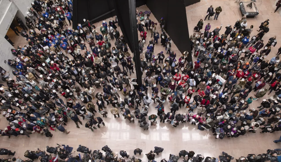 epa07312886 Hundreds of federal workers and their supporters participate in the 'Occupy Hart' protest, against the partial government shutdown sponsored by American Federation of Government Employees, at the Hart Senate Office Building at the US Capitol in Washington, DC, USA, 23 January 2019. Federal workers and their supporters stood silently for 33 minutes for the 33 days of the shutdown. EPA/ERIK S. LESSER