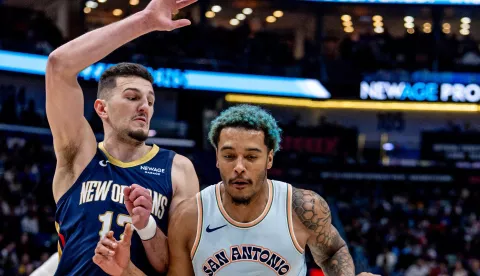 Feb 23, 2025; New Orleans, Louisiana, USA; San Antonio Spurs forward Jeremy Sochan (10) dribbles against New Orleans Pelicans center Karlo Matkovic (17) during the second half at Smoothie King Center. Mandatory Credit: Stephen Lew-Imagn Images Photo: Stephen Lew/REUTERS