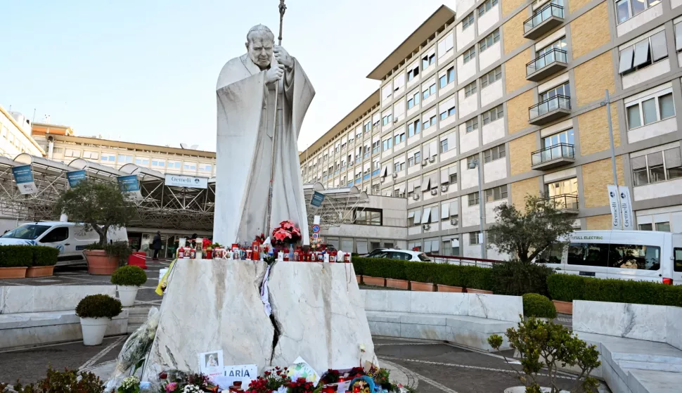 epa11927268 Drawings, candles, and messages for the healing of Pope Francis sit at the statue of John Paul II outside Agostino Gemelli Hospital where he remains hospitalized, in Rome, Italy, 27 February 2025. The pope was admitted to hospital on 14 February due to a respiratory tract infection. EPA/MAURIZIO BRAMBATTI