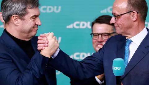 epa11919476 Chairman of Germany's Christian Democratic Union (CDU) Friedrich Merz (R) and State Premier of Bavaria and Christian Social Union (CSU) chairman Markus Soeder (L) celebrate during the Christian Democratic Union (CDU) election event in Berlin, Germany, 23 February 2025. EPA/HANNIBAL HANSCHKE