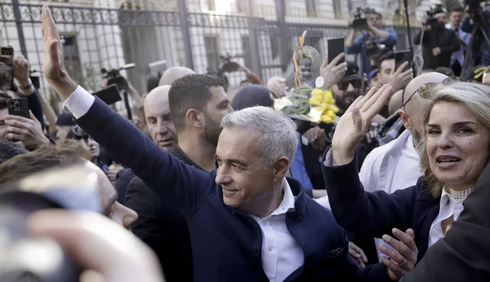 epa11947179 The independent candidate supported by ultra-nationalist AUR party Calin Georgescu (C), who won the first round of Romania's annulled presidential elections, greets supporters as he arrives at the Central Election Bureau (BEC) to register his candidacy for presidential elections in Bucharest, Romania, 07 March 2025. Former independent presidential candidate Calin Georgescu was questioned by prosecutors on 26 February 2025 as part of an investigation into election campaign fraud, including actions against the constitutional order and false statements about campaign financing. A judge from the Prosecutor General's Office imposed a judicial control measure, which Georgescu appealed. Romanians will vote in the first round of the presidential elections on 4 May 2025. EPA/ROBERT GHEMENT