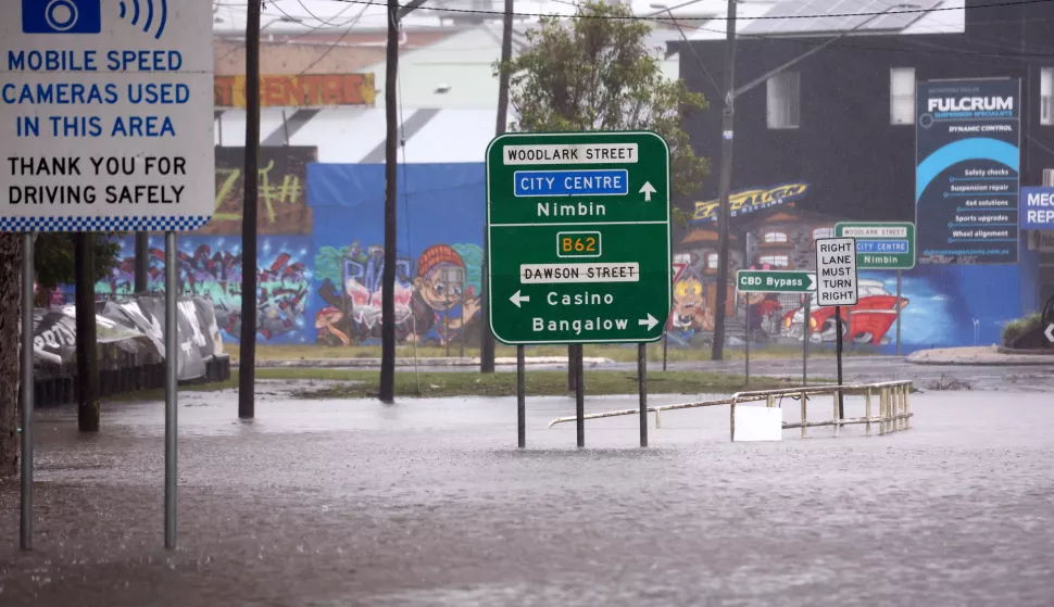 epa11950534 A flooded area on Woodlark Street as residents in New South Wales and Queensland have been told to bunker down for dangerous conditions, including flash flooding, heavy rain, and intense winds, as Tropical Cyclone Alfred was downgraded to a tropical low in Lismore, Australia, 09 March 2025. Authorities are concerned a river levee in Lismore could be breached, with major flooding expected at the Wilsons River. EPA/Jason O'Brien AUSTRALIA AND NEW ZEALAND OUT
