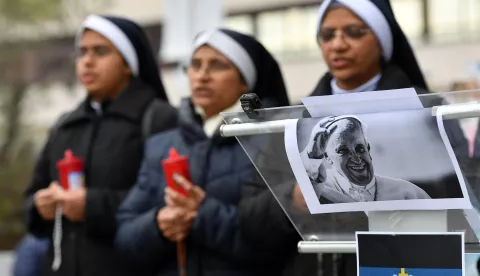 epa11951967 Nuns pray outside the Gemelli Hospital, where Pope Francis is hospitalized, Rome, Italy, 09 March 2025. Pope Francis was admitted to Rome's Gemelli Hospital on 14 February, due to a respiratory tract infection. EPA/FABIO CIMAGLIA