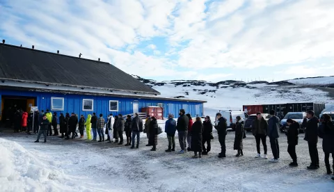 epa11955635 People line up to vote during the parliamentary election at the Godthaabshallen sports hall, in Nuuk, Greenland, 11 March 2025. Greenland residents will vote on 11 March to elect 31 members to the Inatsisartut, the Greenlandic parliament, with six parties contesting. EPA/MADS CLAUS RASMUSSEN DENMARK OUT