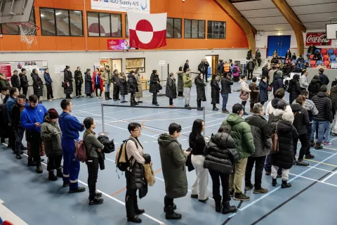 epa11956558 People line up to vote during the parliamentary election at the Godthaabshallen sports hall, in Nuuk, Greenland, 11 March 2025. Greenland residents will vote on 11 March to elect 31 members to the Inatsisartut, the Greenlandic parliament, with six parties contesting. EPA/MADS CLAUS RASMUSSEN DENMARK OUT