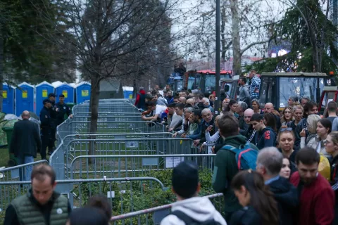 epa11964889 Supporters of university students gather at the fence of a pro-government supporters camp in Belgrade, Serbia, 14 March 2025. The students are demanding accountability after fifteen people were killed in the collapse of the Novi Sad Railway Station canopy in November 2024. The station, which had been renovated and reopened in July 2024, was undergoing further construction at the time of the collapse. Meanwhile, government supporters have set up a makeshift camp at the planned protest site, where a rally is expected to take place in response to the student-led demonstration. EPA/ANDREJ CUKIC