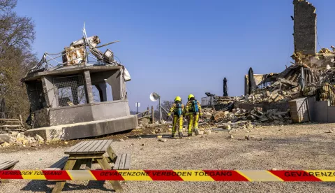 epa11967840 Firefighters at the collapsed Wilhelmina tower in Valkenburg, The Netherlands, 16 March 2025. The tower suddenly collapsed overnight on 16 March with the cause still unknown. The observation tower on the Heunsberg, a national monument, is a well-known attraction in the South Limburg town. EPA/MARCEL VAN HOORN