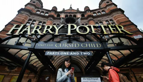 epa05483400 (FILE) A file picture dated 29 July 2016 shows Harry Potter fans using mobile phones outside the Palace Theatre in London, Britain, which stages British writer J.K. Rowling's play 'Harry Potter and the Cursed Child'. Tickets for the sell-out show are being sold for 8,300 pounds sterling online - sixty times more than their 140 pounds face value. However buyers may find themselves denied entry using a ticket bought from a tout as part of a crack-down on tickets from resale sites. EPA/ANDY RAIN