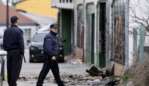 epa11969553 Police officers secure the area around the 'Club Pulse' nightclub after a fire, in Kocani, Republic of North Macedonia, 17 March 2025. A fire at a discotheque in Kocani in the early hours of 16 March 2025 claimed the lives of at least 59 people and left over 100 injured, according to initial reports from the Directorate for Protection and Rescue and the Center for Crisis Management. EPA/GEORGI LICOVSKI
