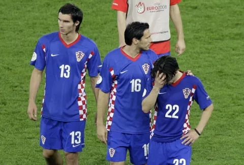 Croatia's Nikola Pokrivac, Jerko Leko and Danijel Pranjic, from left, react after the quarterfinal match between Croatia and Turkey in Vienna, Austria, Friday, June 20, 2008, at the Euro 2008 European Soccer Championships in Austria and Switzerland. Turkey defeated Croatia 3 penalties to 1 in the final penalty shoot out. (AP Photo/Murad Sezer)