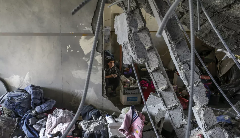 epa11970911 A Palestinian boy looks on inside a destroyed area of Al Tabien school following Israeli airstrikes in Gaza City, 18 March 2025. The Israeli forces on 18 March confirmed they were carrying out 'extensive strikes' on targets in the Gaza Strip, following an Israeli prime minister's statement which ended the ceasefire in place since 19 January. According to provisional figures released by the Palestinian Health Minister, more than 250 people were killed in a series of overnight strikes in the Gaza Strip, with more bodies still waiting to be recovered from under the rubble. EPA/MOHAMMED SABER