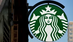 epa04261525 A view of a Starbucks sign in New York, New York, USA, 16 June 2014. The company announced that it is beginning a partnership with Arizona State University to make undergraduate degrees available at a discount to 135,000 U.S. employees who work in the stores at least 20 hours a week. EPA/JUSTIN LANE