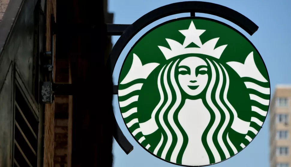 epa04261525 A view of a Starbucks sign in New York, New York, USA, 16 June 2014. The company announced that it is beginning a partnership with Arizona State University to make undergraduate degrees available at a discount to 135,000 U.S. employees who work in the stores at least 20 hours a week. EPA/JUSTIN LANE
