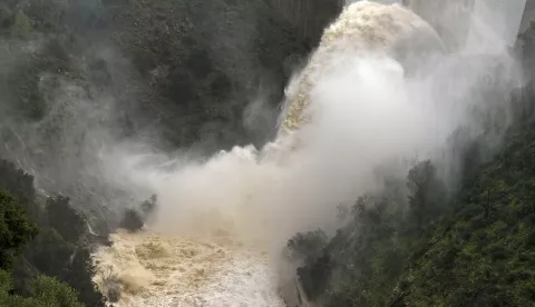 epa11970969 The water is discharged from the Casasola dam as the reservoir reaches its limit, in Almogia, Malaga province, Spain, 18 March 2025. Heavy overnight rains in the province of Malaga caused the Guadalhorce and Campanillas rivers to overflow their banks, affecting several municipalities of Malaga and Cartama. EPA/JORGE ZAPATA