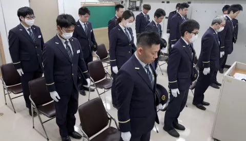 epa11975109 Employees of Tokyo Metro observe a moment of silence for the victims at Kasumigaseki station in Tokyo, Japan, 20 March 2025, the day of the 30th anniversary of the Tokyo subway sarin gas attack. On 20 March 1995, the cult Aum Shinrikyo sarin gas attack on the subway killed 14 people and injured more than 6,000 others. EPA/JAPAN POOL JAPAN OUT EDITORIAL USE ONLY