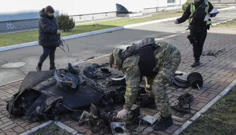 epaselect epa11971464 Ukrainian experts inspect the debris of a Russian drone that fell in the morning near a school on the outskirts of Kyiv, Ukraine, 18 March 2025, amid the ongoing Russian invasion. According to the Ukrainian Air Force, Russia launched over 100 shock drones against Ukraine during the night of 18 March 2025, with no casualties reported. EPA/SERGEY DOLZHENKO