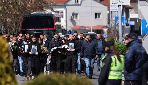 epa11975534 Mourners arrive carrying flowers and photos of the victims ahead of the mass funeral for the victims of the nightclub fire in Kocani, Republic of North Macedonia, 20 March 2025. The fire at a discotheque in Kocani in the early hours of 16 March 2025 claimed the lives of at least 59 people and left over 100 injured, according to initial reports from the Directorate for Protection and Rescue and the Center for Crisis Management. EPA/Georgi Licovski