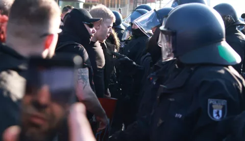 epa11981399 Participants (L) confront police officers as they are not allowed to start their walk during a right-wing demonstration in Berlin, Germany, 22 March 2025. The right-wing demonstration takes place under the motto 'For law and orders Against left-wing extremism and politically motivated violence'. Various counter-demonstrations were announced to be held at the same time. EPA/CLEMENS BILAN