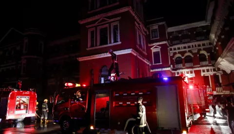 epa06947913 Fire fighters in action near fire engines during a fire that broke out at Yangon General Hospital in Yangon, Myanmar, 13 August 2018. No injuries or casualties were reported in the fire which broke out from a medicine store at Yangon General Hospital. EPA/LYNN BO BO